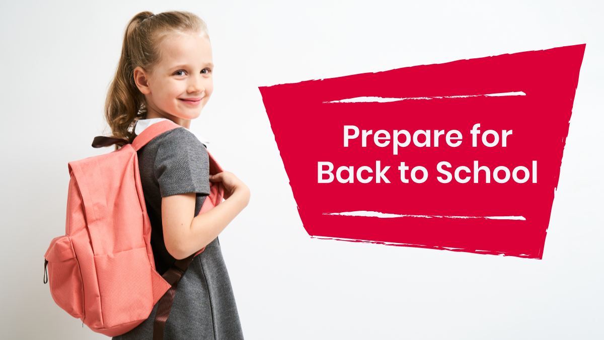a little girl wearing a pink bookbag smiling