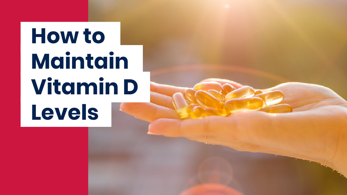 Hand holding pills to maintain Vitamin D levels